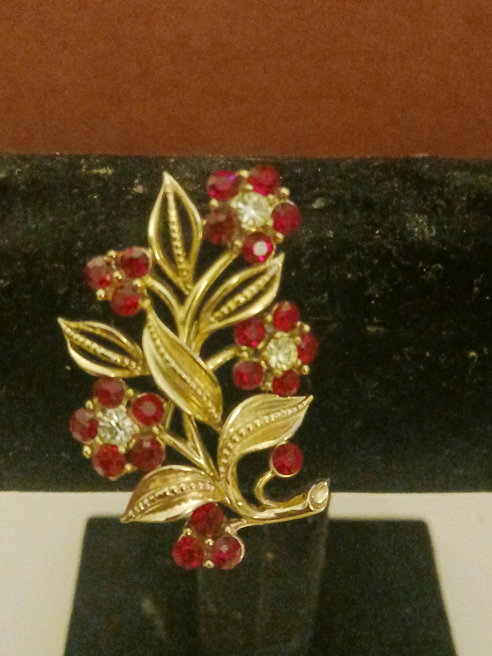 Gold-Tone Floral Branch Brooch with Red and Clear Stones